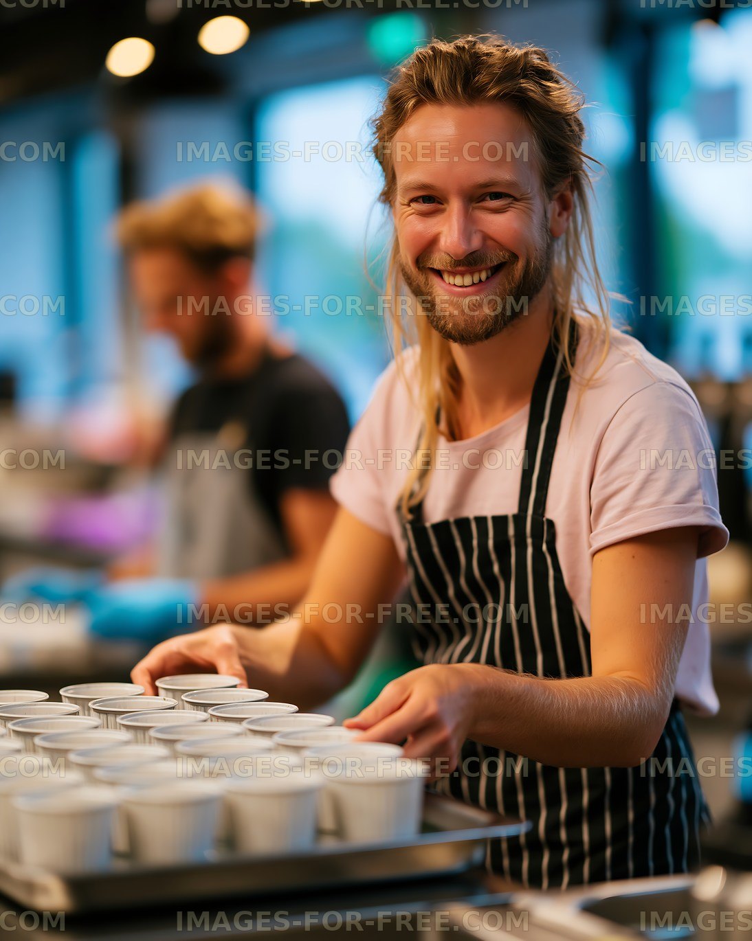 Barista preparing coffee cups in a busy cafe