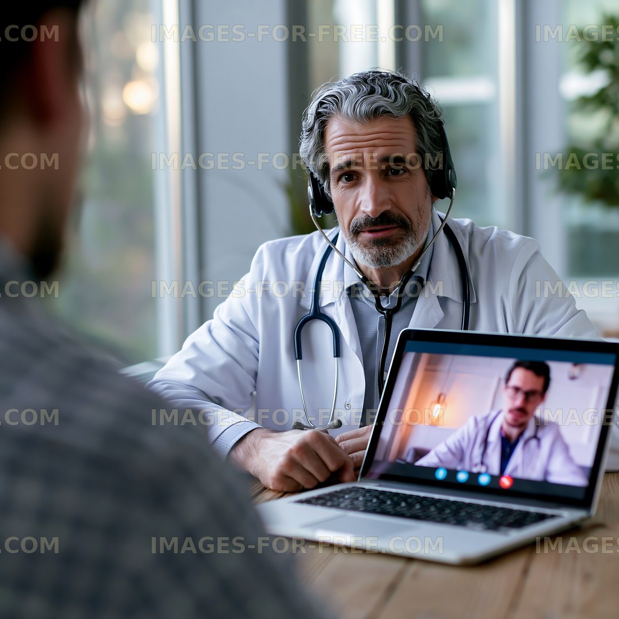 Doctor consulting patient via video call at home