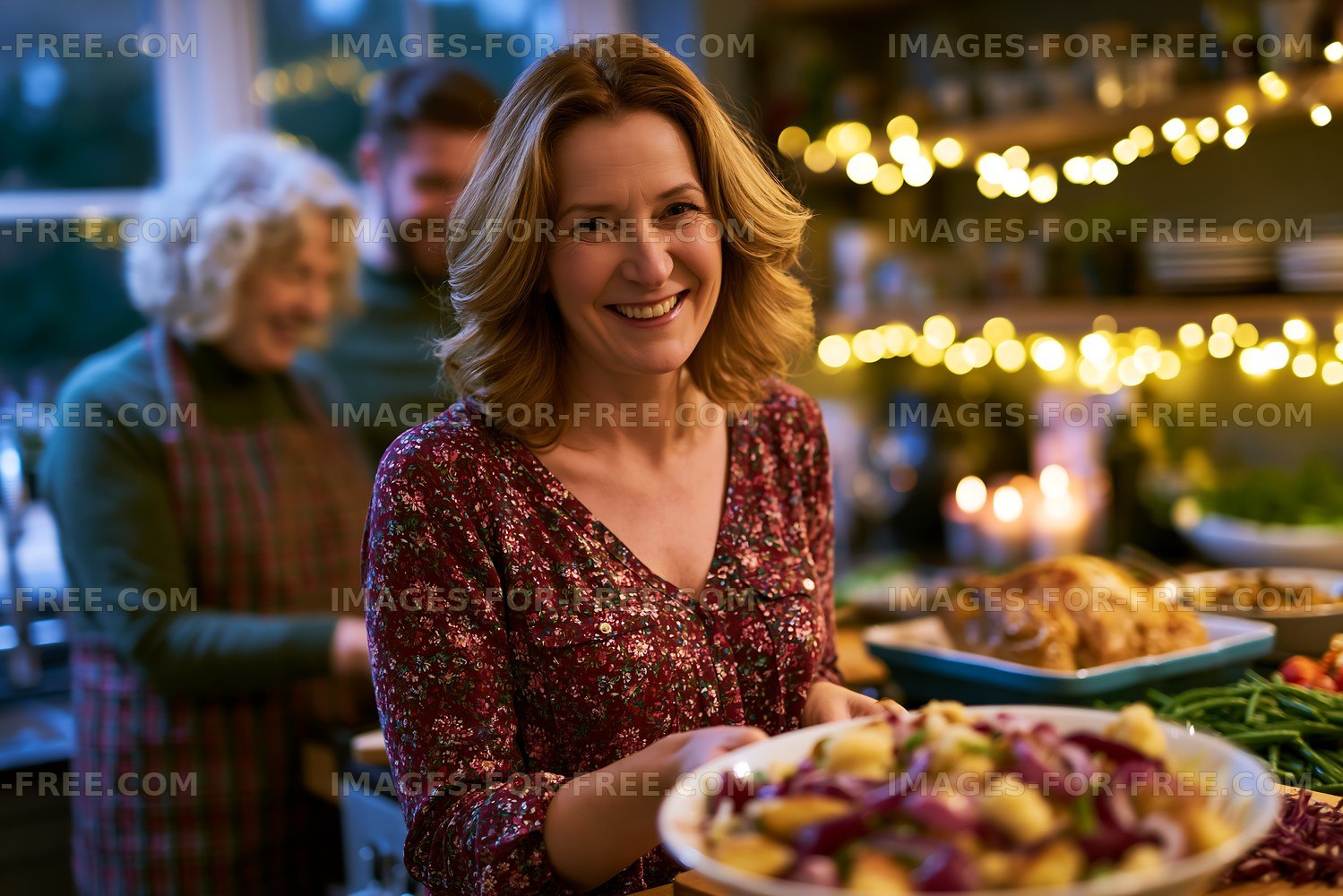 Woman serving food in a cozy kitchen during a festive gathering