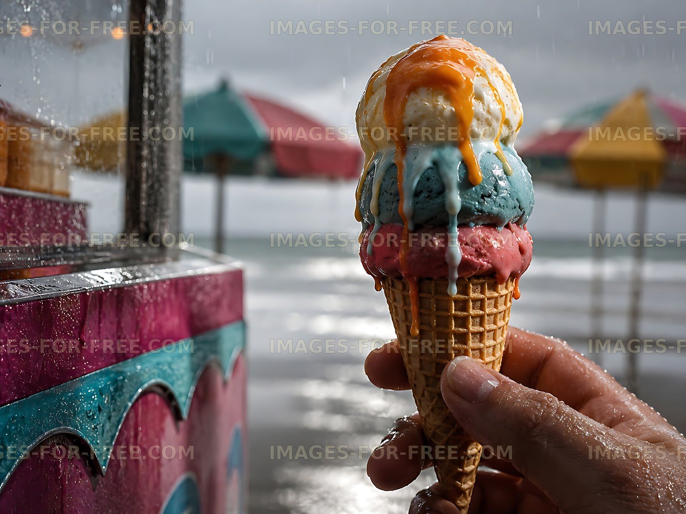 Colorful ice cream cone held by a person near the beach