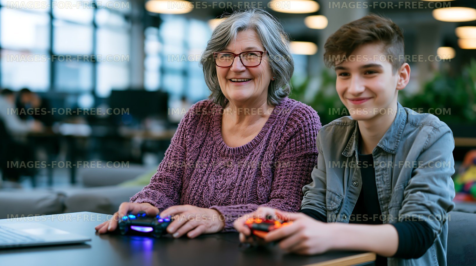 Young boy and senior woman playing video games together