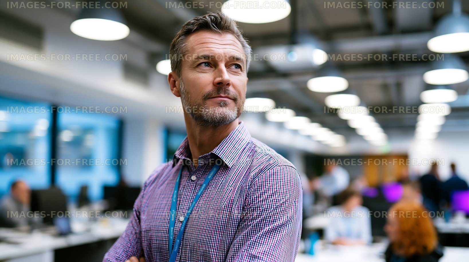 Business man in office looking thoughtful