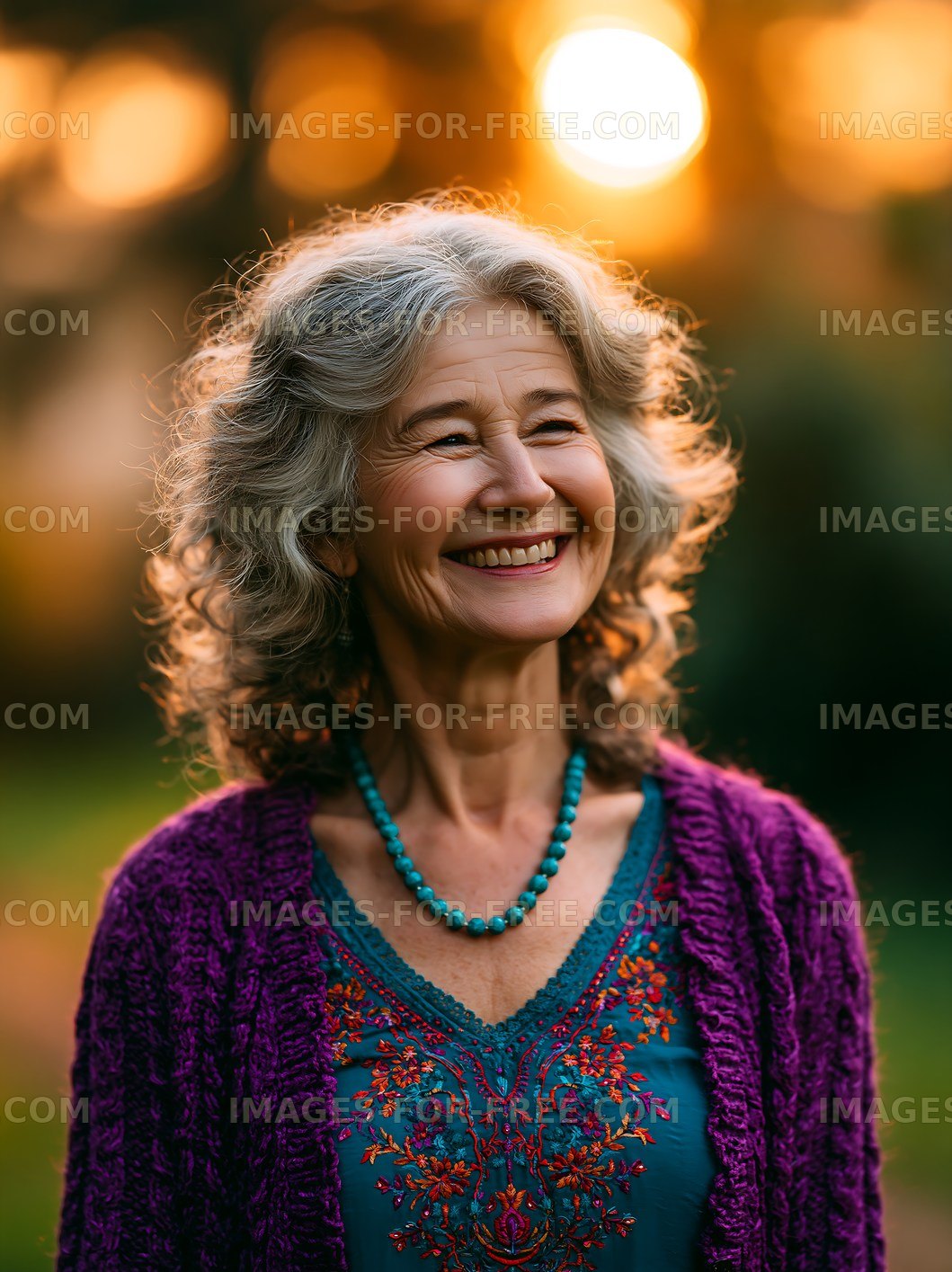 Happy senior woman smiling outdoors at sunset