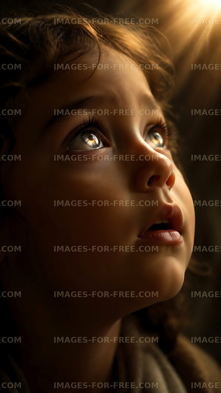 Child looking up admiring light from a window
