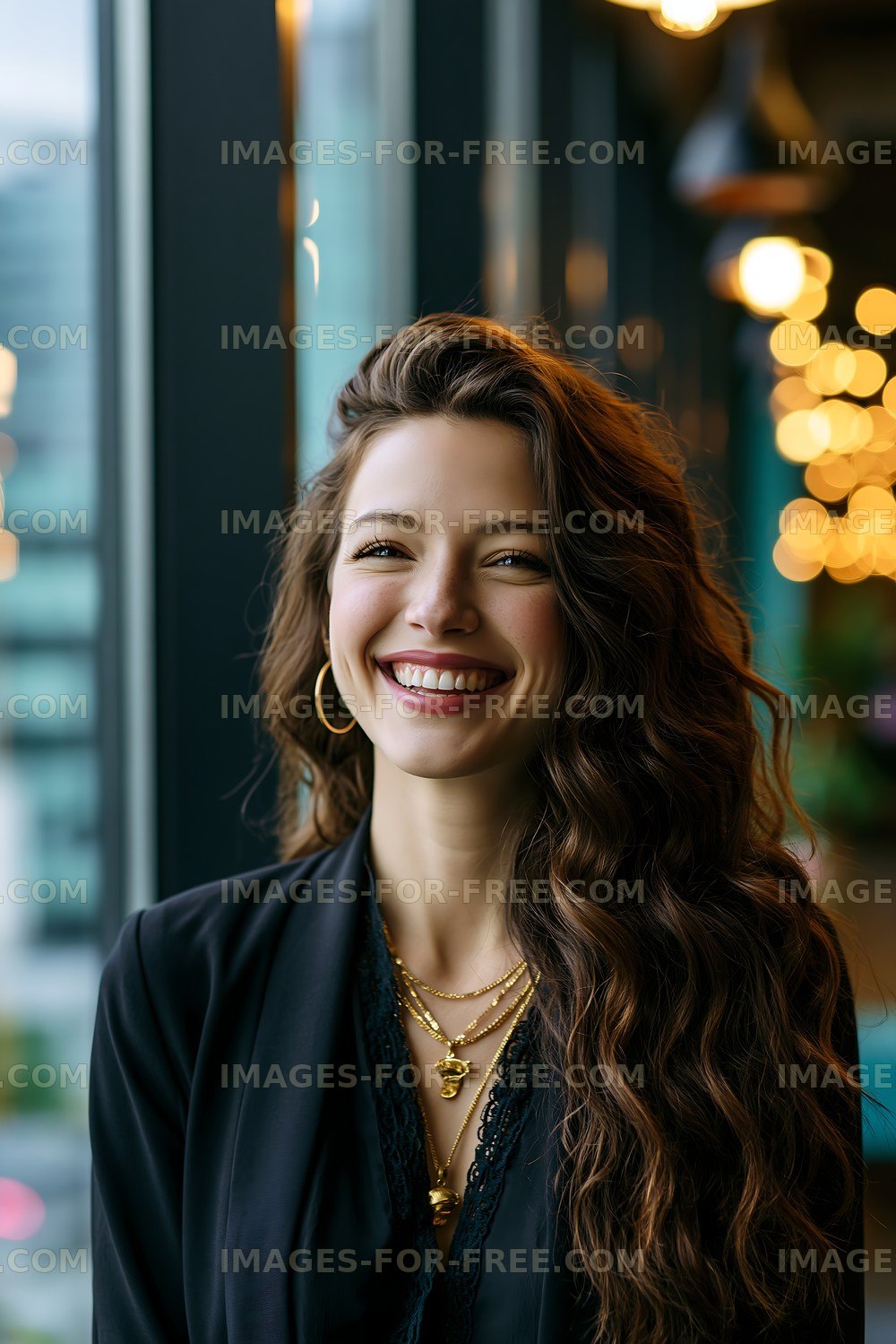 Woman smiling near window with urban view