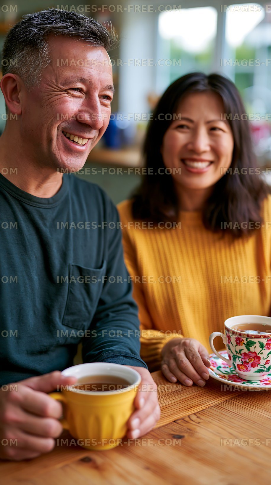 Smiling couple enjoying coffee at a cozy cafe