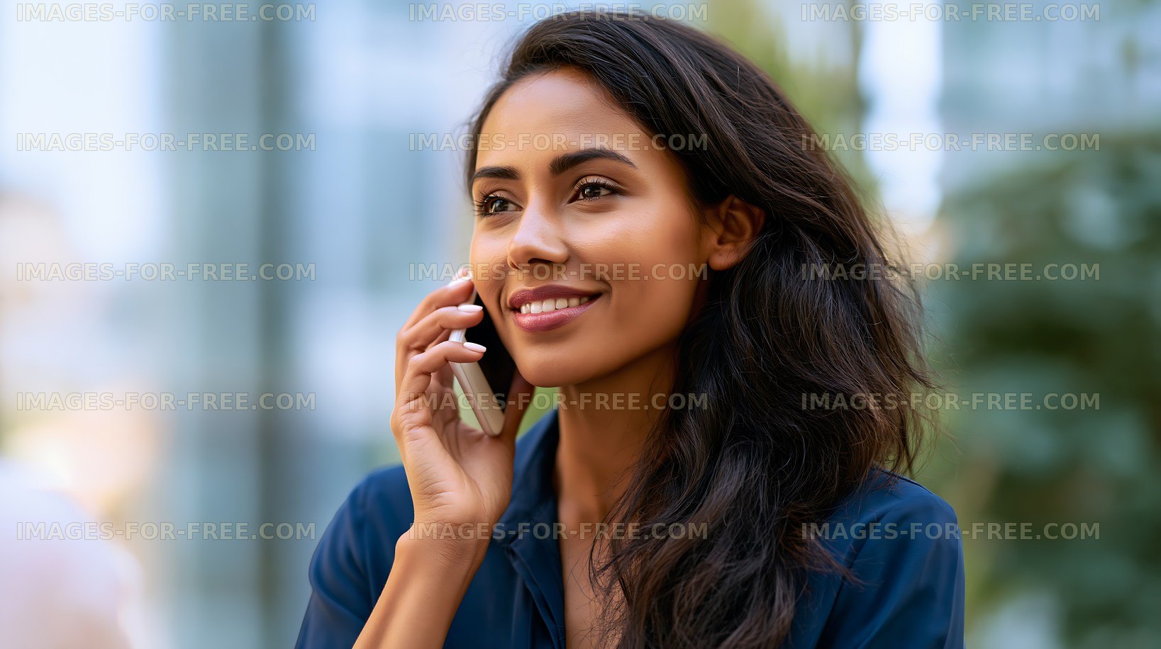 Smiling woman talking on phone in urban outdoor setting