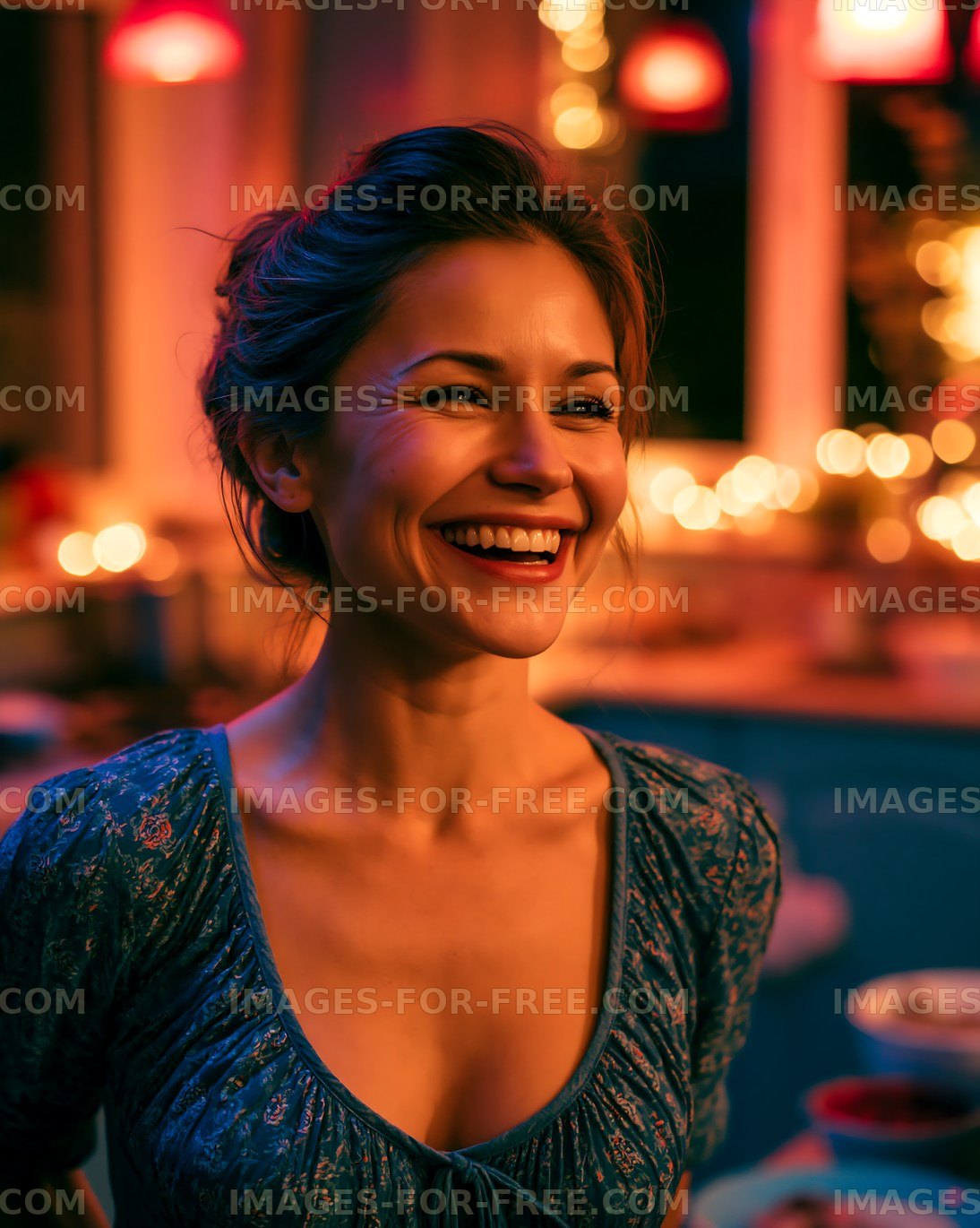 Woman smiling in a warmly lit kitchen during a cozy gathering