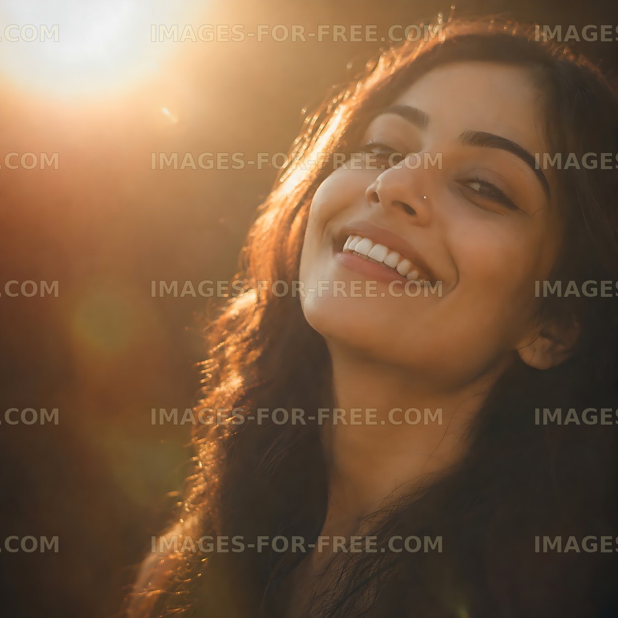 Woman smiling in sunlight with natural background