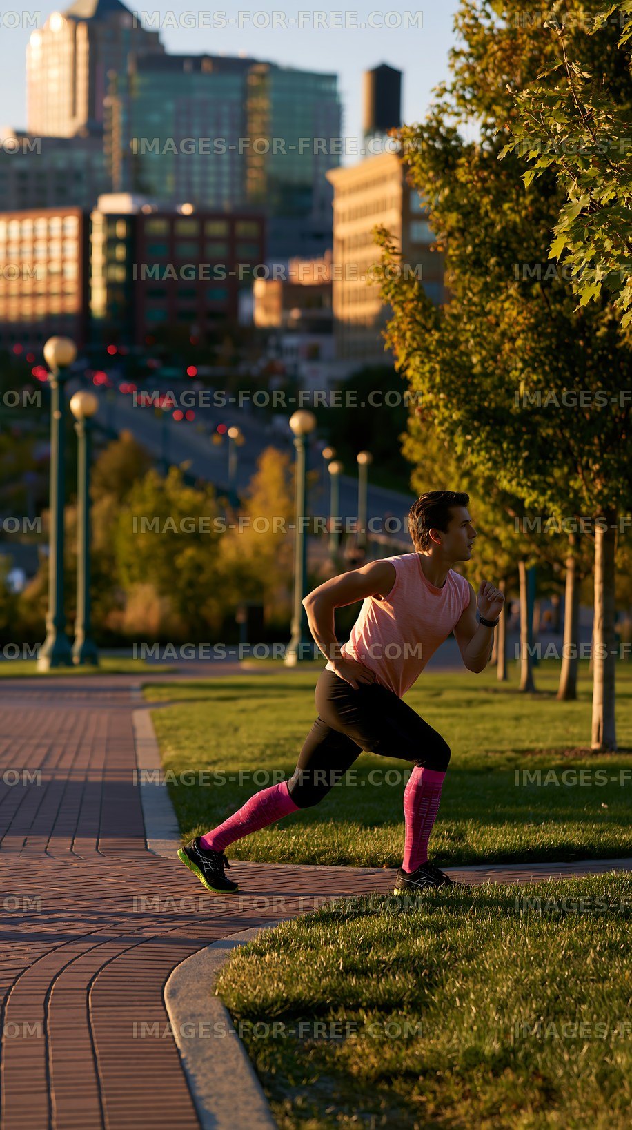 Runner exercising in city park during sunset