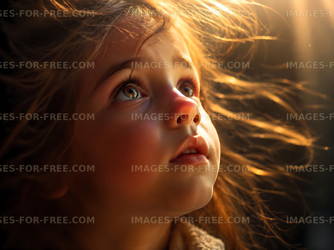 Child gazing upward with light illuminating her face