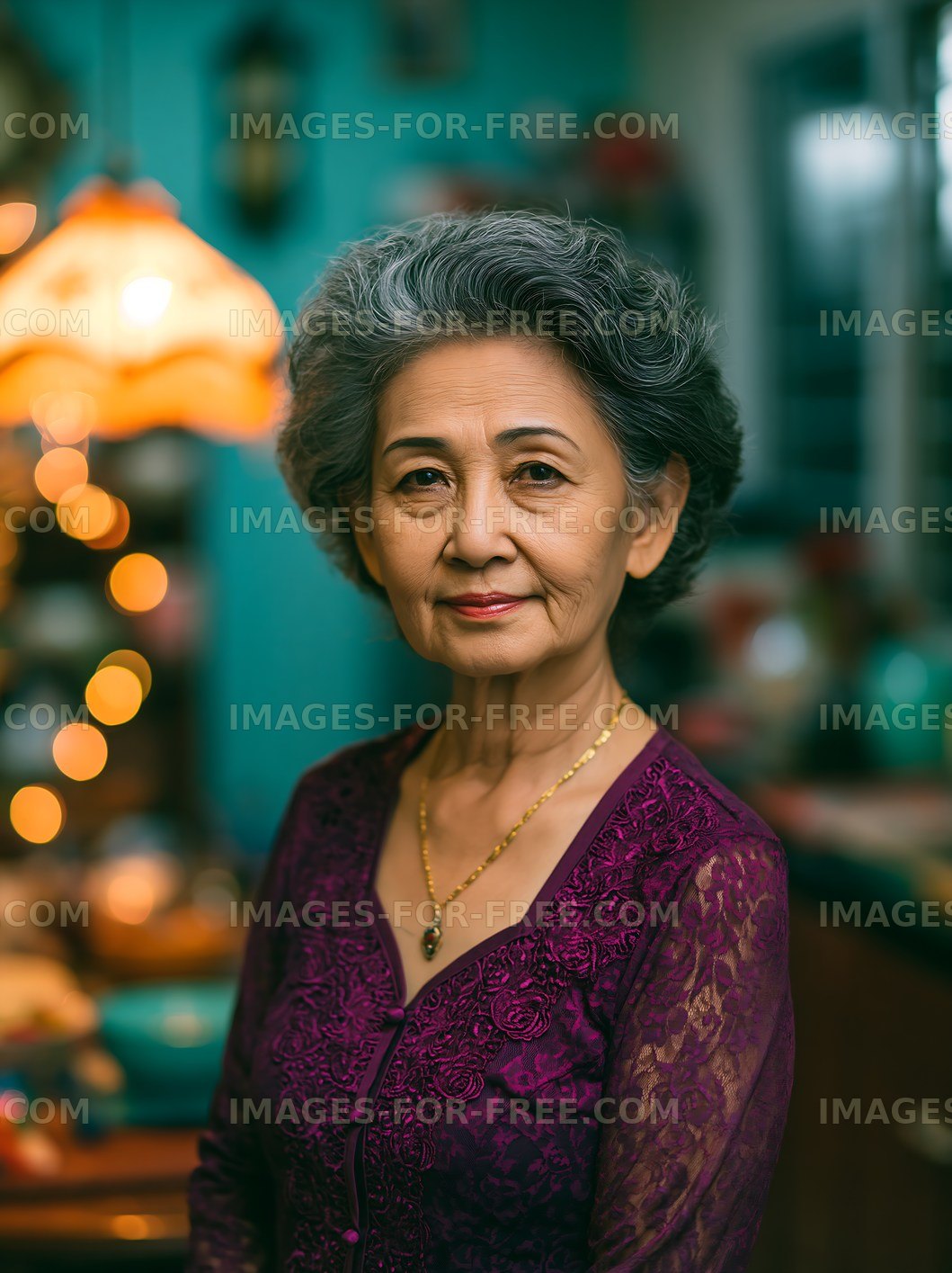 Older woman in purple attire poses in a well-decorated room