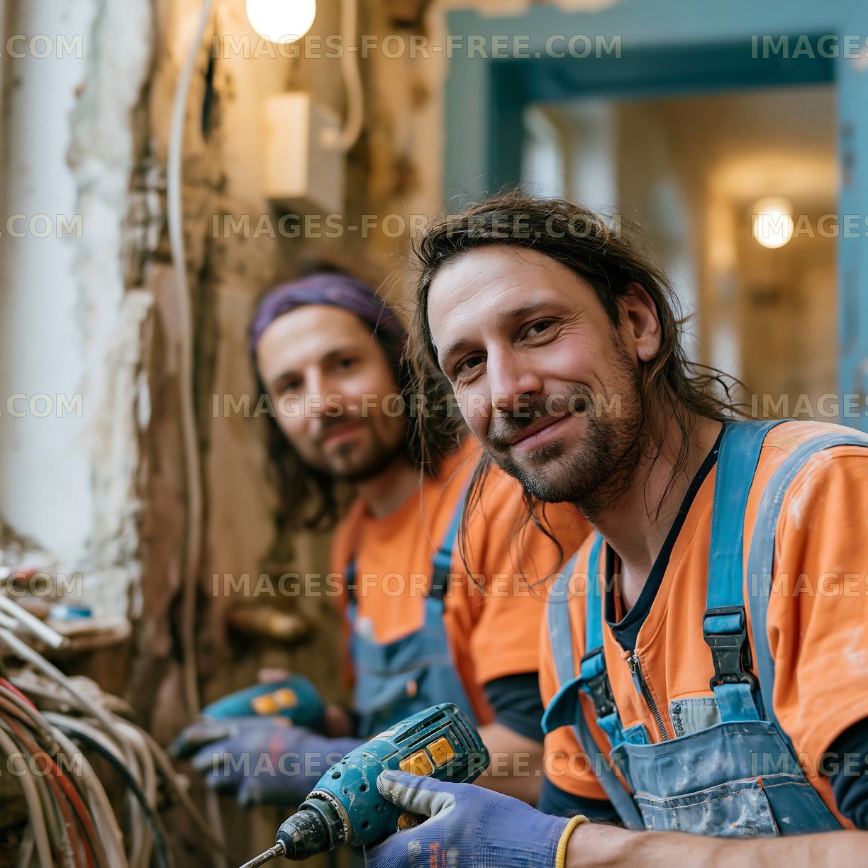 Electricians working on a renovation project in an old building