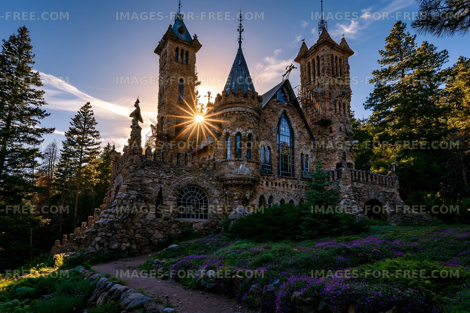 Stone castle with towers in forest during sunset