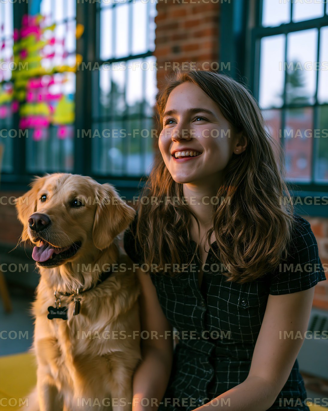 Smiling woman with golden retriever in a bright indoor space