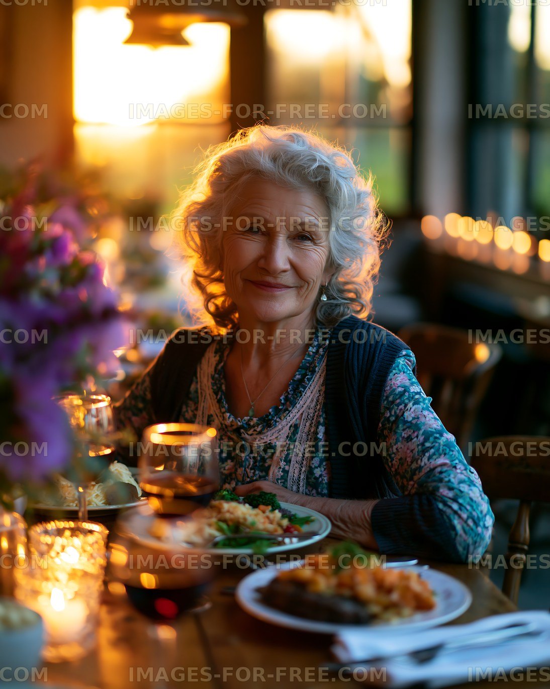 Senior woman enjoying dinner during sunset gathering