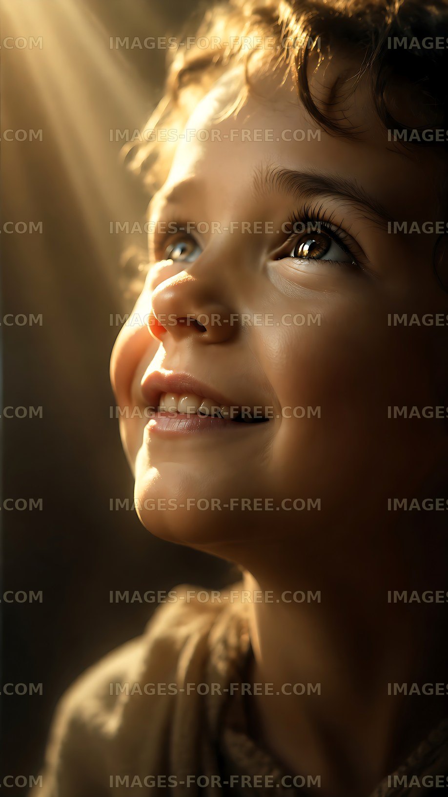 Child smiling and looking up with light shining on the face