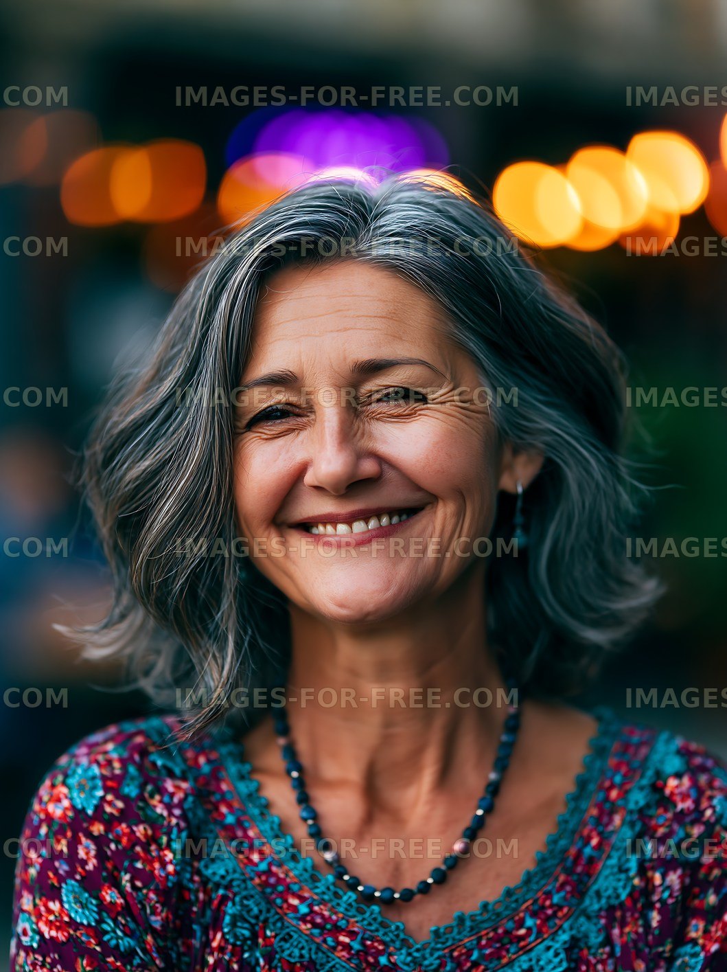 Smiling woman with gray hair in outdoor setting