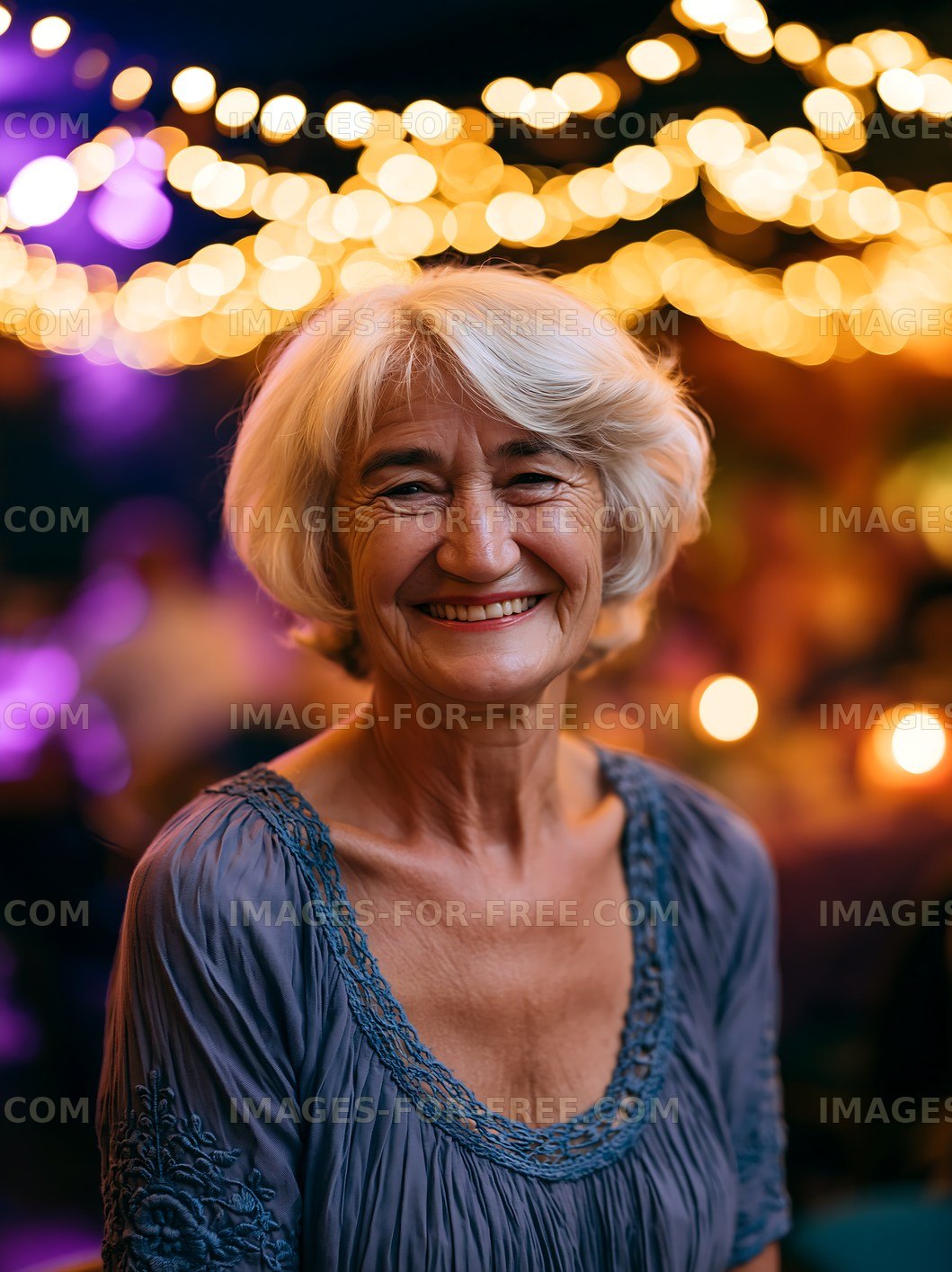 Smiling woman with gray hair in a festive setting