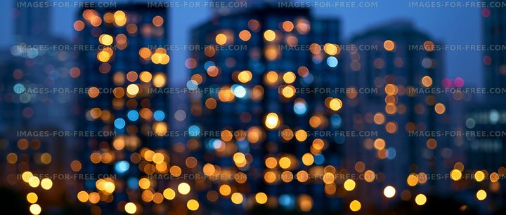 City skyline with blurred lights at dusk