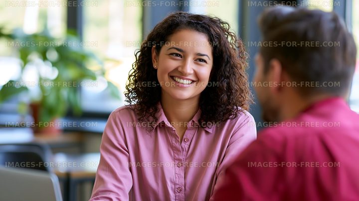 Smiling woman engaging in conversation with a man
