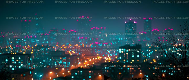 Night view of a city skyline with colorful lights