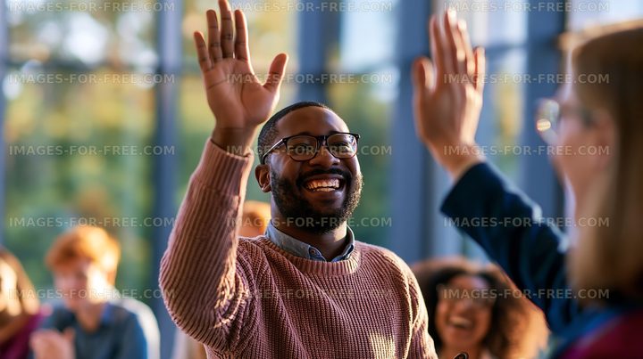 Man smiling and waving with group of people in a meeting